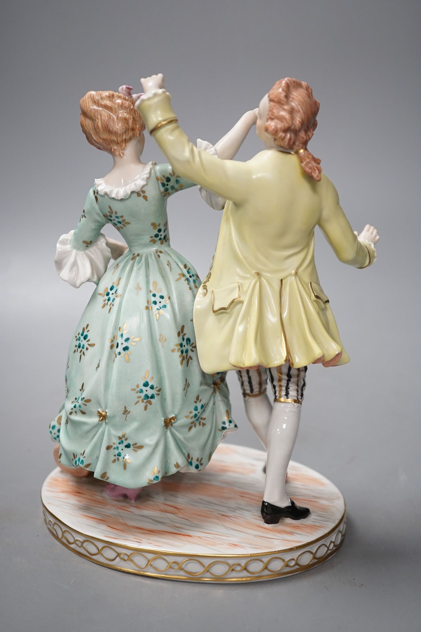 A Dresden porcelain group of a dancing couple 21cm